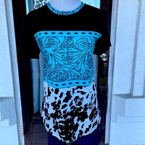 shirt that has cow print and a western print